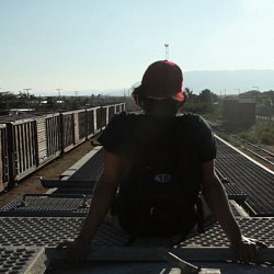 Gael Garcia Bernal rides the roof of a train traveling North (photo by Marc Silver)