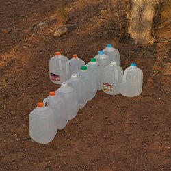 Water left along a migrant trail by Humanitarian workers (photo by Marc silver)